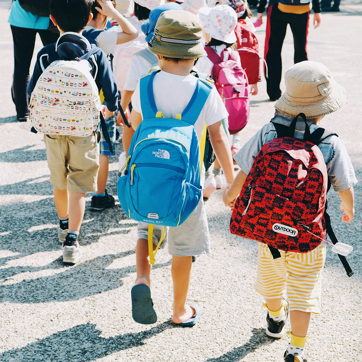 elementary students holding hands